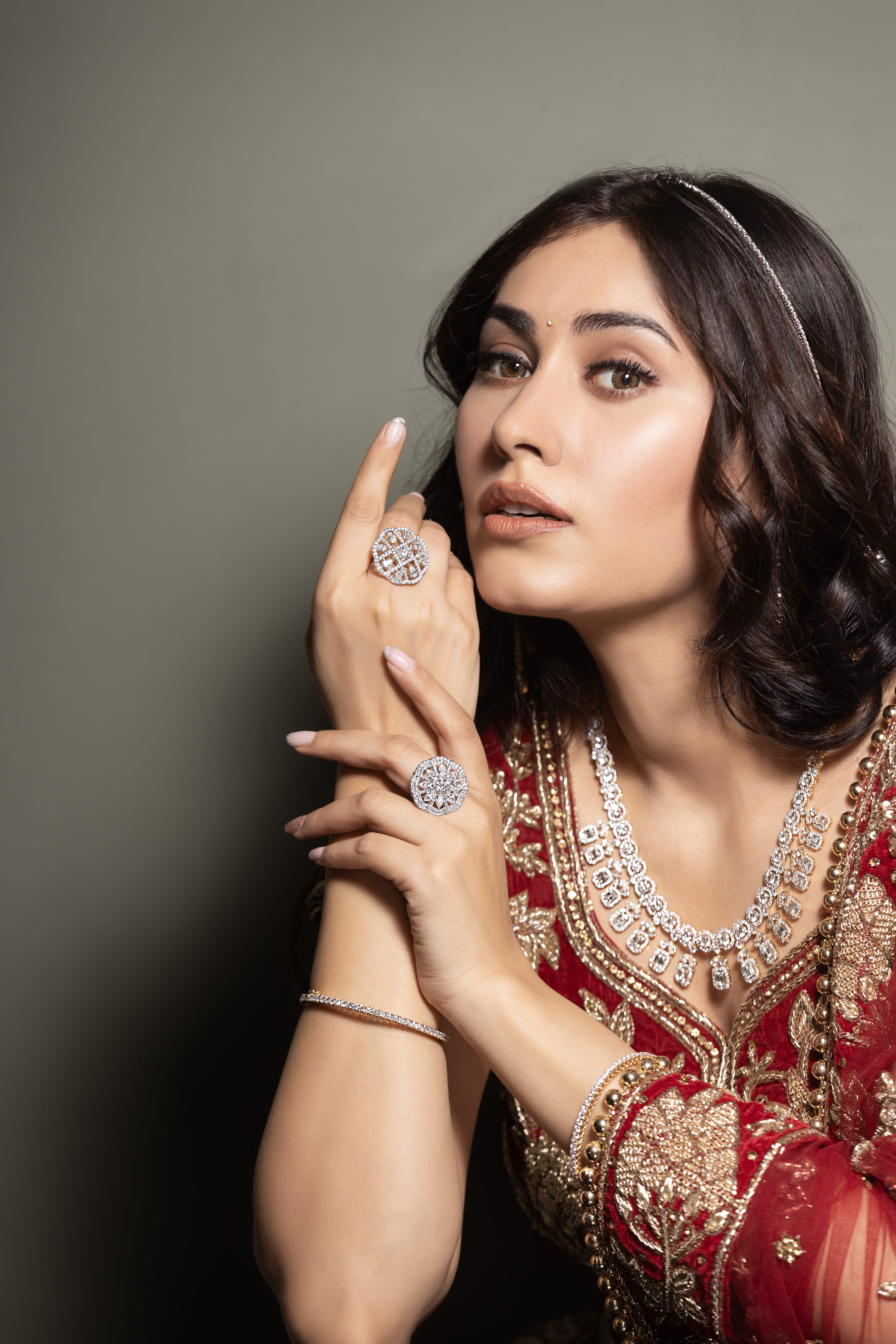 Hand wearing stacked gold rings