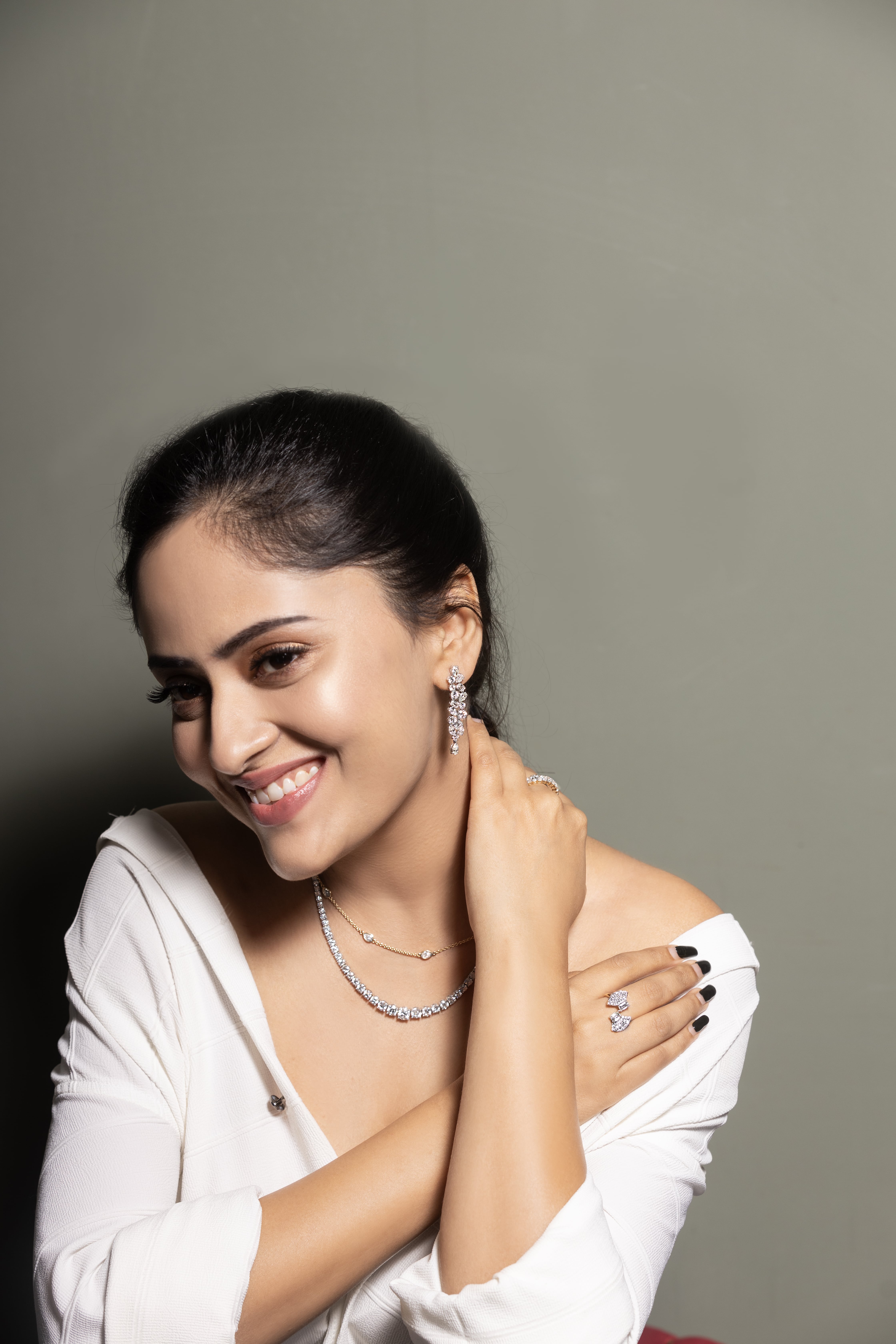 Hand wearing stacked gold rings