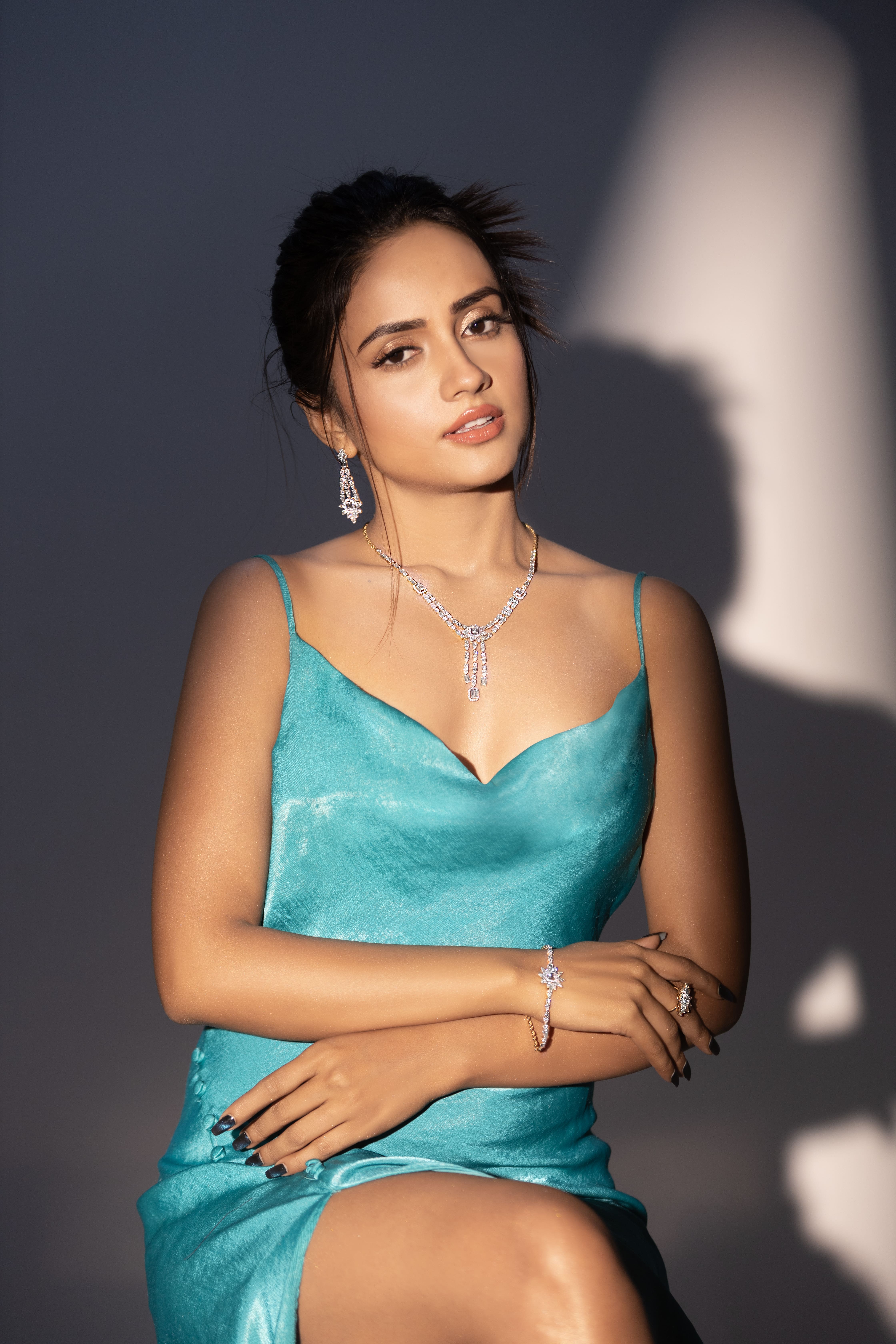 Hand wearing stacked gold rings